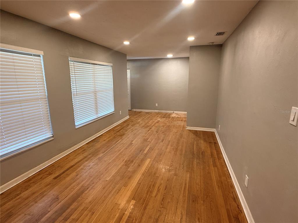 1908 West St Louis Street Tampa, FL 33607 - Photo 19 of 28 an empty room with wooden floor and windows