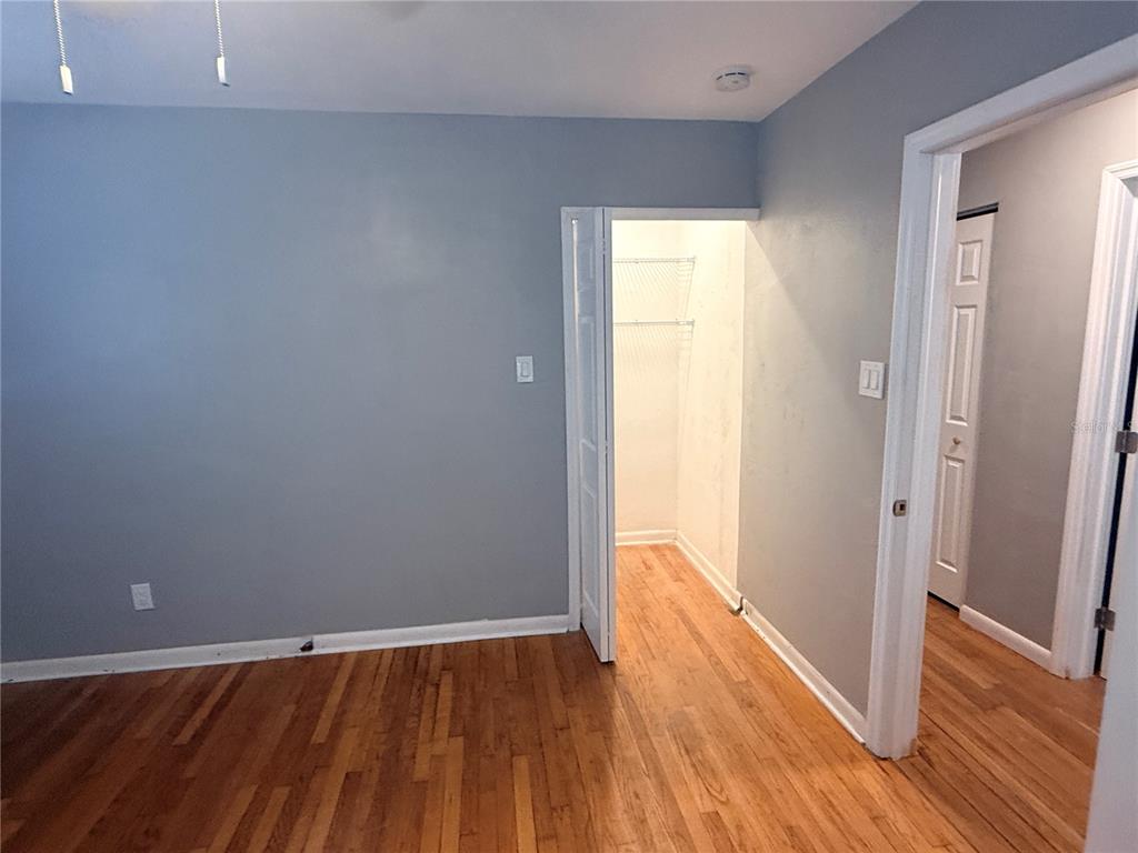 1908 West St Louis Street Tampa, FL 33607 - Photo 21 of 28 a view of an empty room with wooden floor and a window
