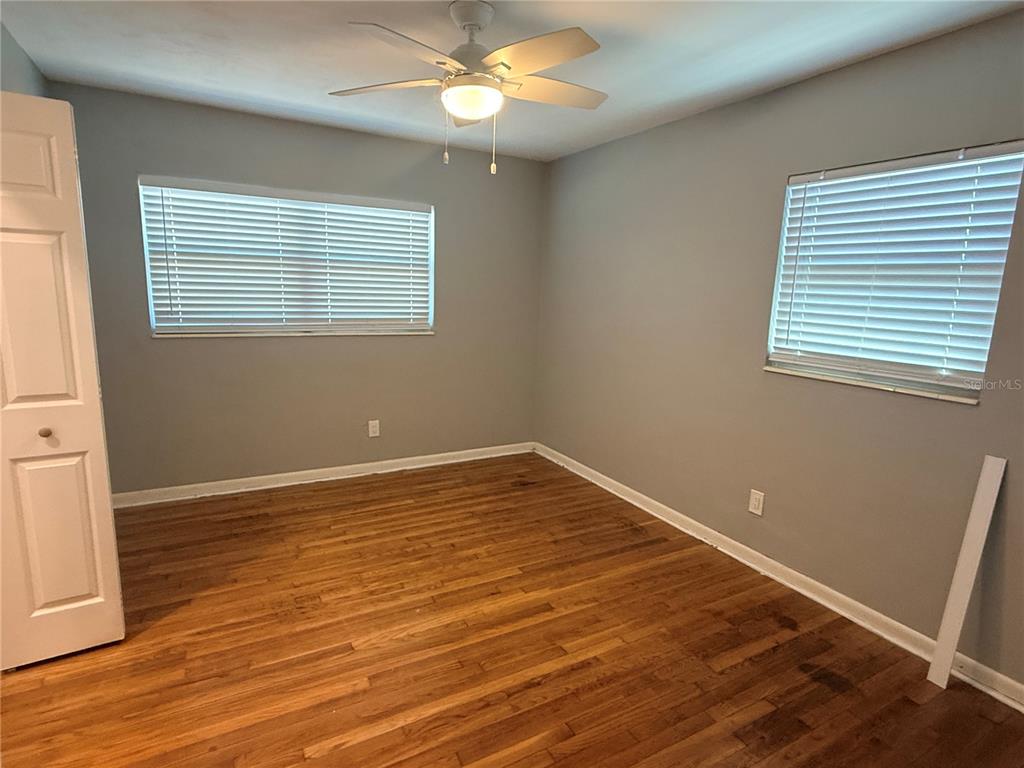 1908 West St Louis Street Tampa, FL 33607 - Photo 22 of 28 a view of an empty room with wooden floor and a window