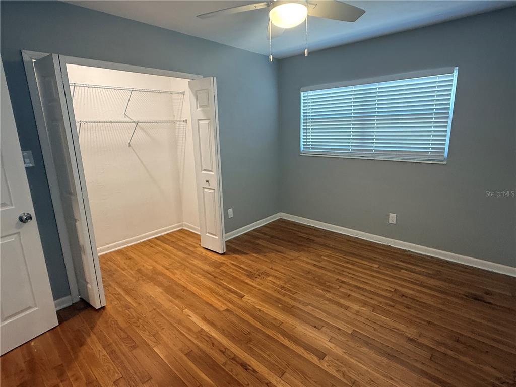 1908 West St Louis Street Tampa, FL 33607 - Photo 23 of 28 an empty room with wooden floor and windows