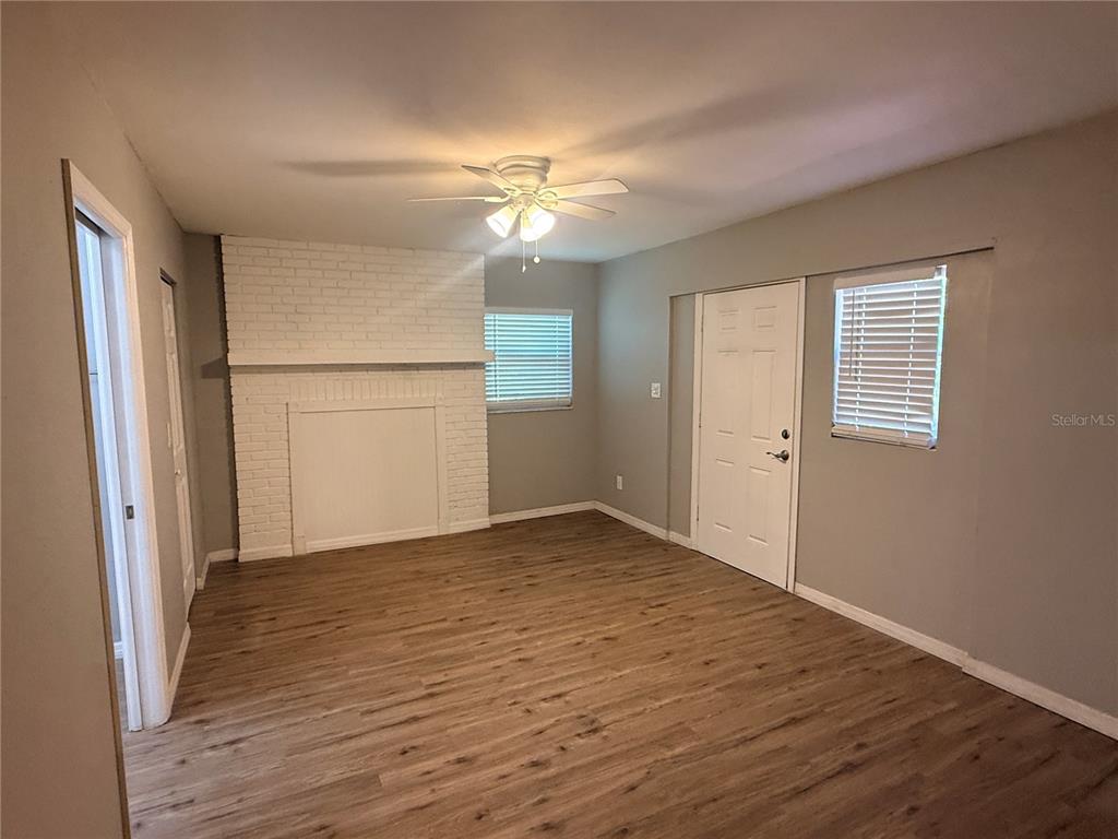 1908 West St Louis Street Tampa, FL 33607 - Photo 24 of 28 a view of an empty room with wooden floor and a window