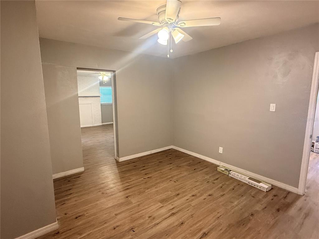 1908 West St Louis Street Tampa, FL 33607 - Photo 25 of 28 an empty room with wooden floor and fan