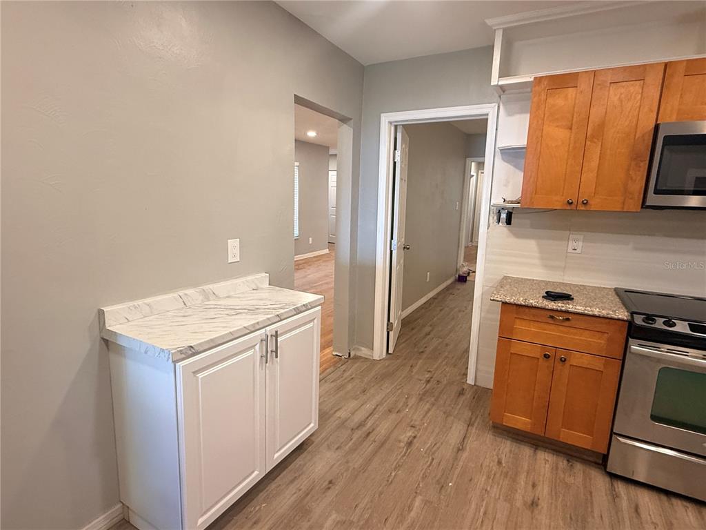 1908 West St Louis Street Tampa, FL 33607 - Photo 3 of 28 a kitchen with a stove and a refrigerator