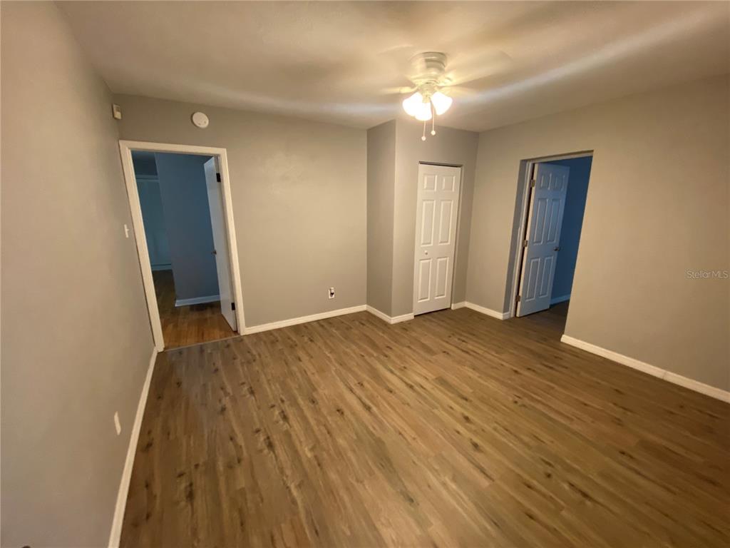 1908 West St Louis Street Tampa, FL 33607 - Photo 9 of 28 an empty room with wooden floor and closet