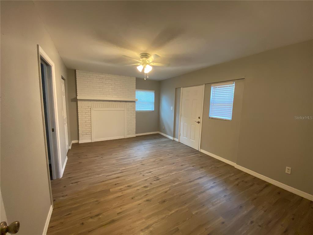 1908 West St Louis Street Tampa, FL 33607 - Photo 10 of 28 an empty room with wooden floor and windows