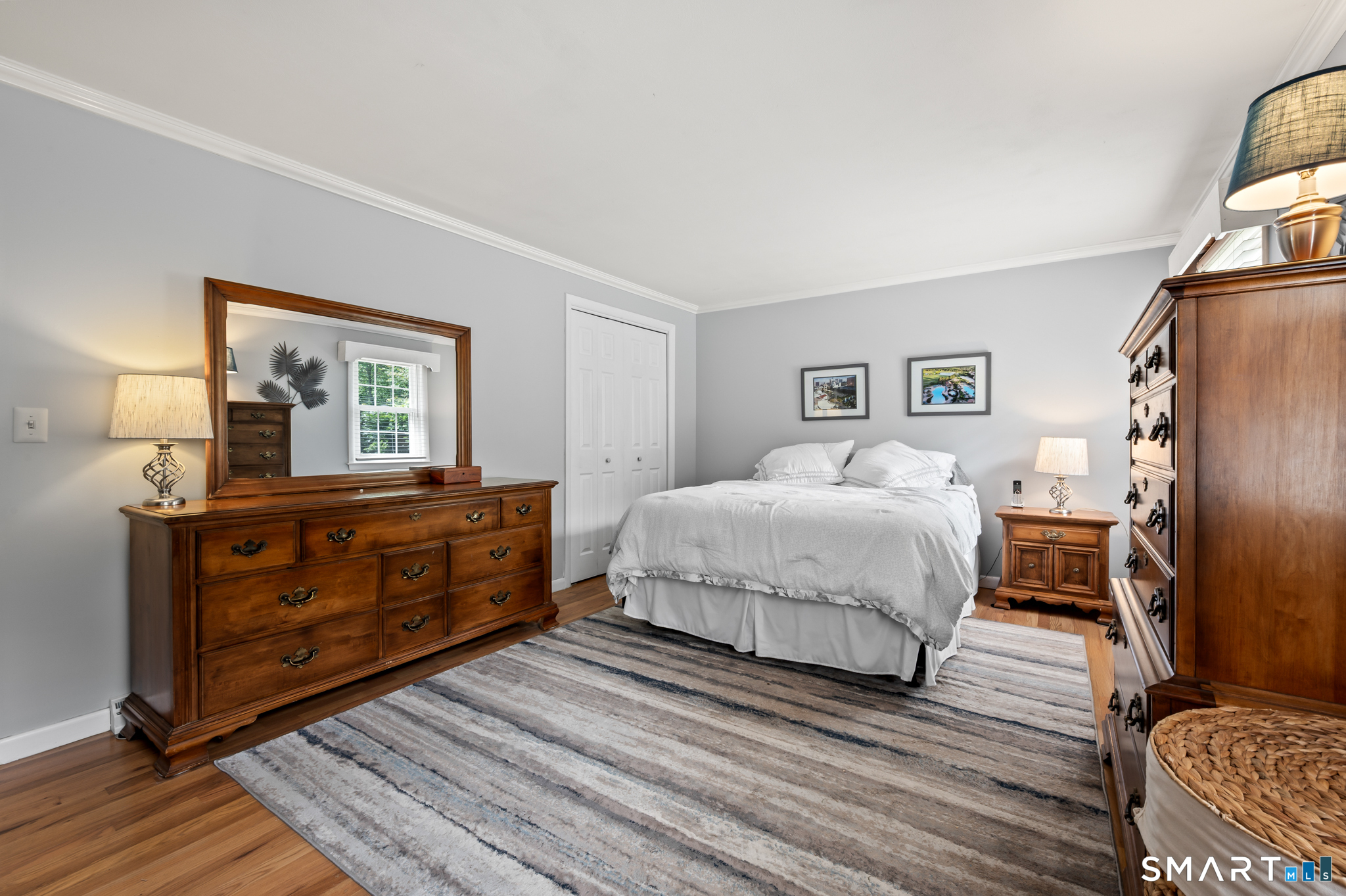 1611 Shepard Avenue Hamden, CT 06518 - Photo 17 of 31 a bedroom with a bed and wooden floor