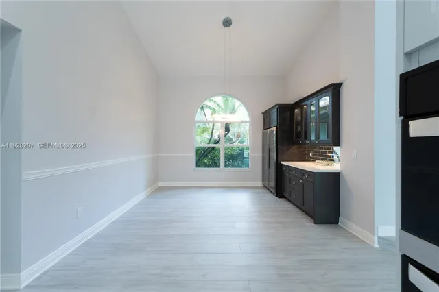 a bathroom with a bathtub and a window