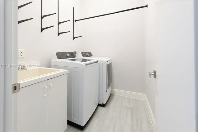 a utility room with dryer and washer