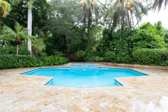 a view of a swimming pool with an outdoor space
