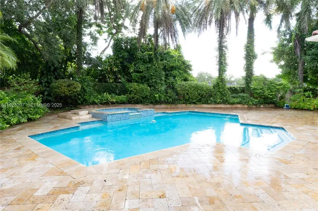 a view of swimming pool with a yard