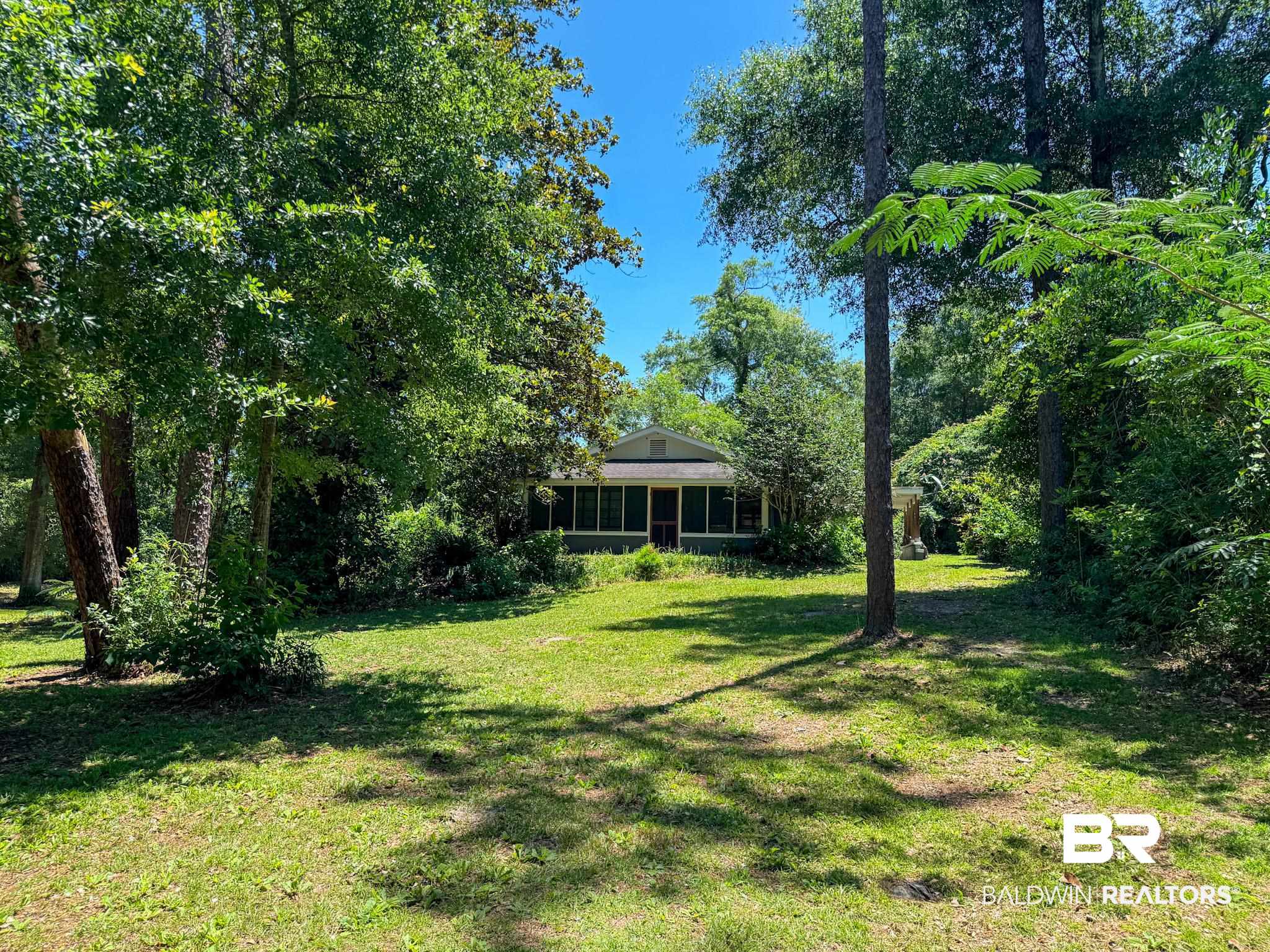 18711 Keller Road Foley, AL 36535 - Photo 32 of 38 Single-story residence featuring a screened porch and a gable roofline