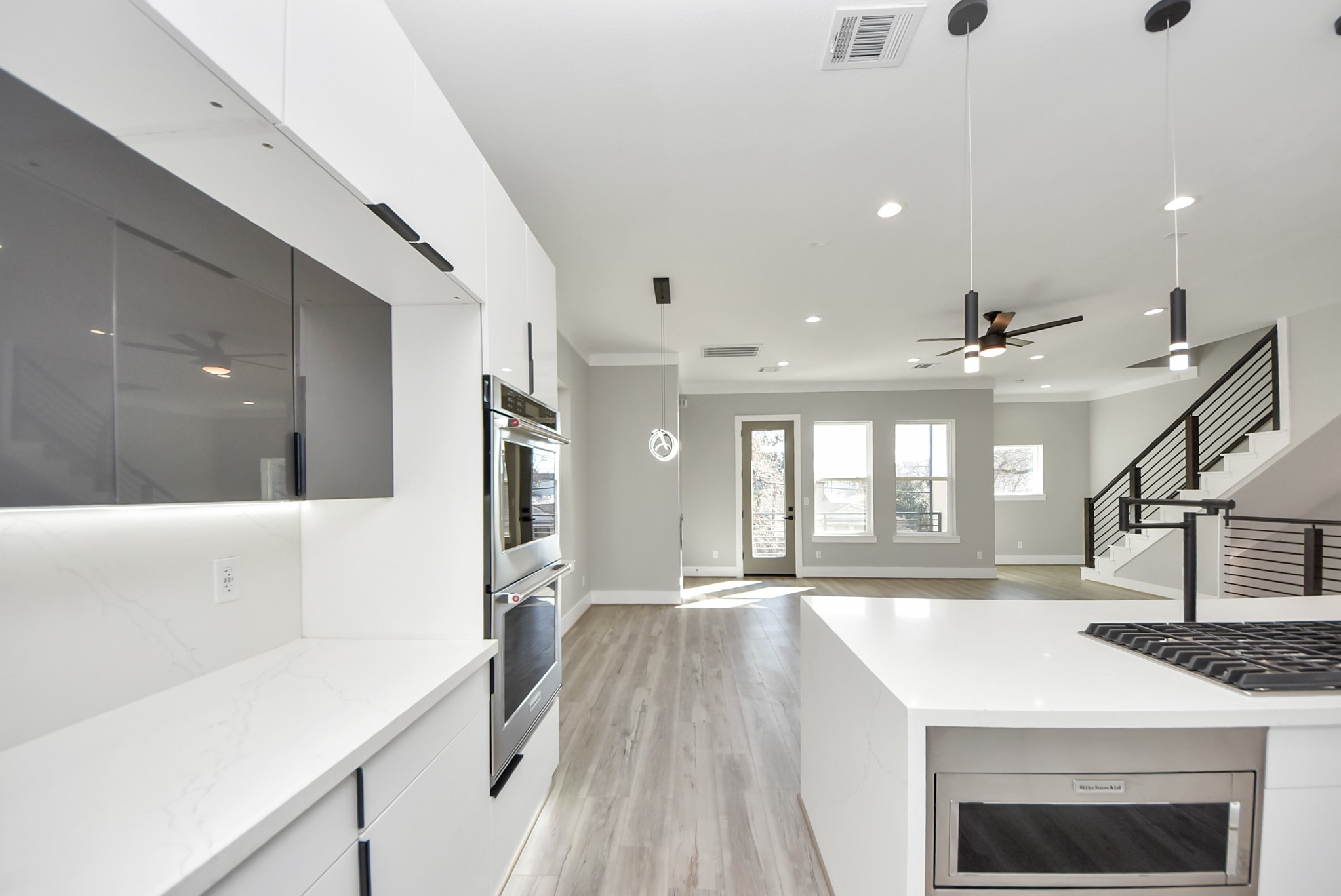 602 West 28th Street, Unit A Houston, TX 77008 - Photo 14 of 41 a open kitchen with a sink a stove and a refrigerator
