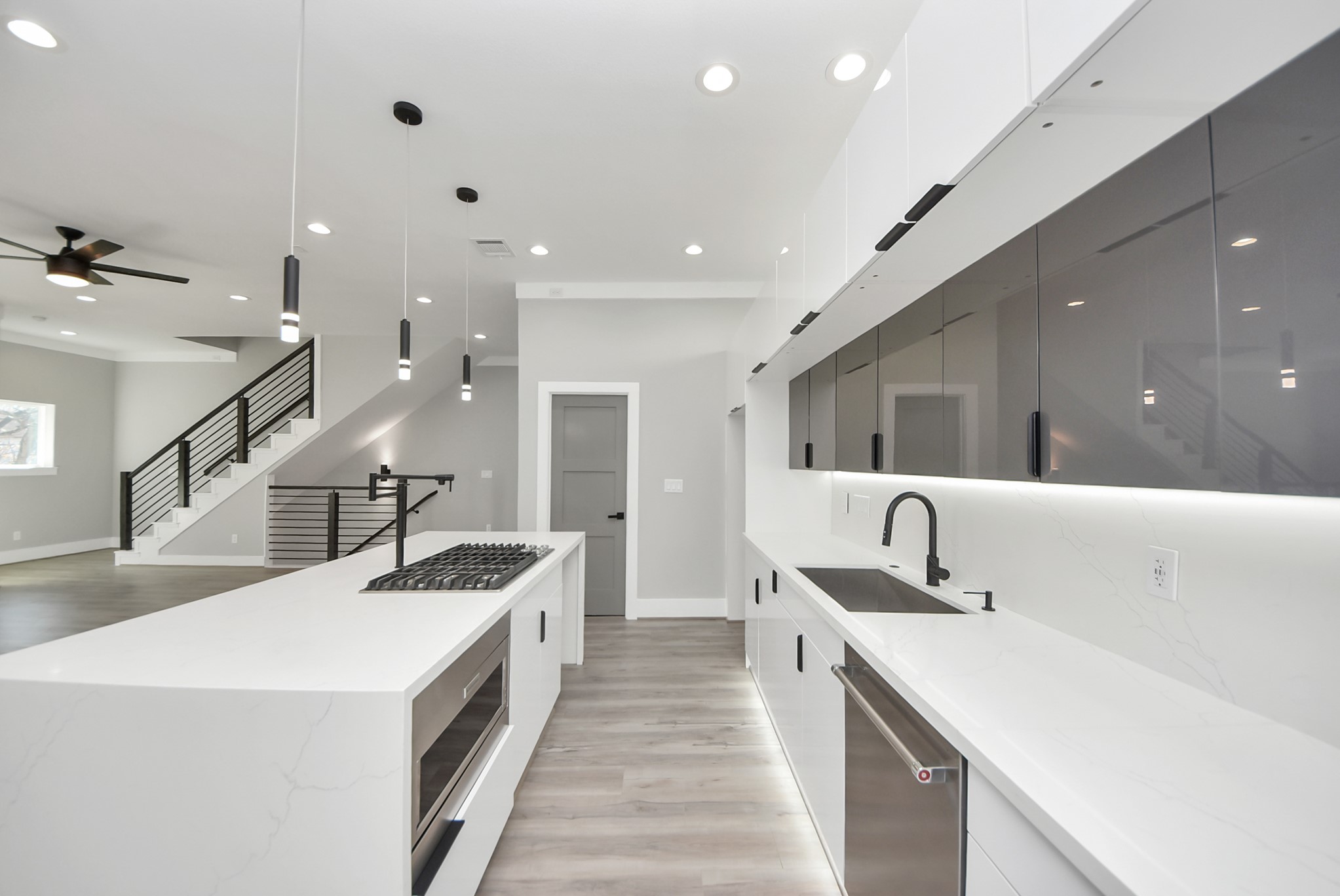 602 West 28th Street, Unit A Houston, TX 77008 - Photo 15 of 41 a large white kitchen with a sink and large mirror