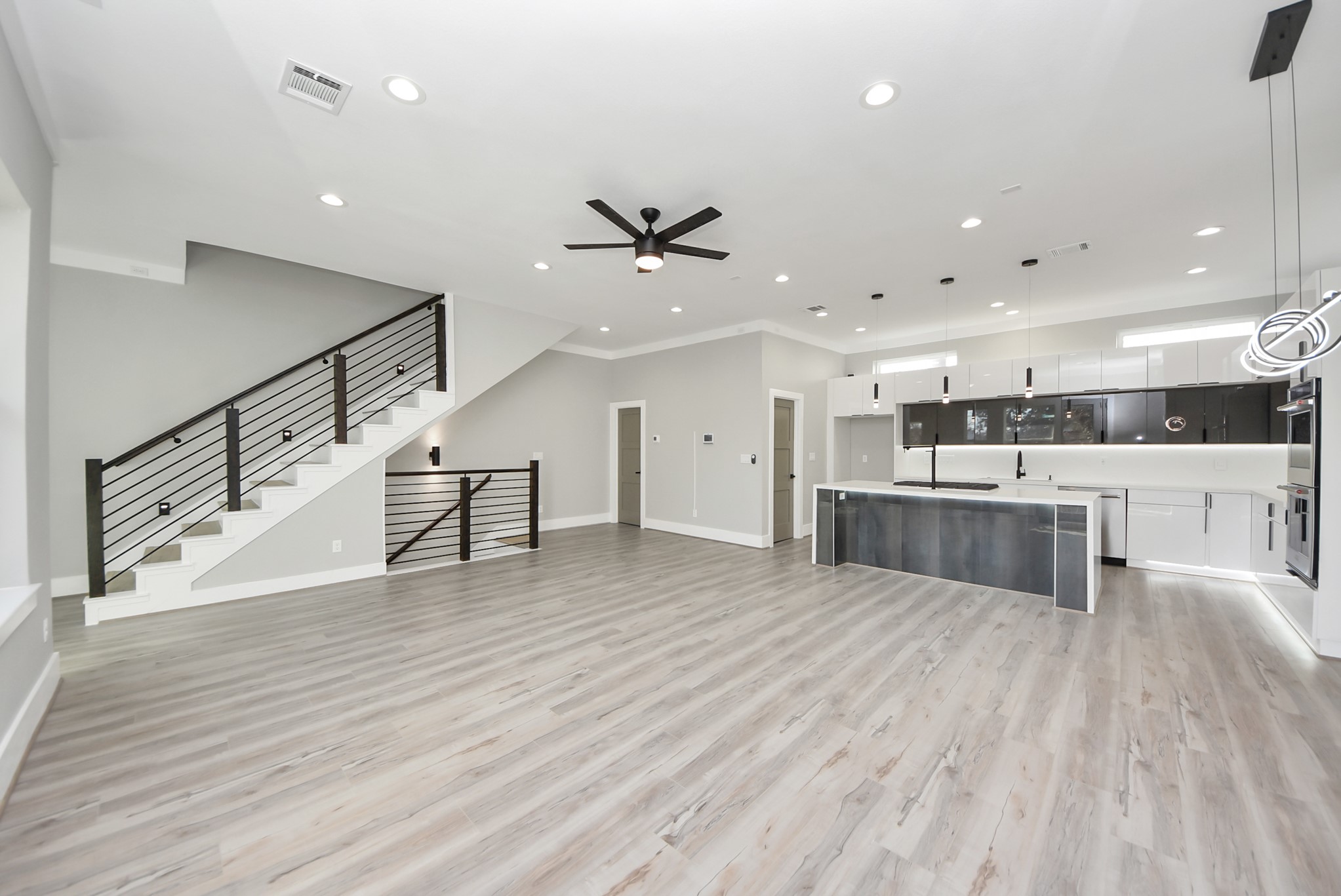 602 West 28th Street, Unit A Houston, TX 77008 - Photo 19 of 41 a view of kitchen with cabinets and wooden floor