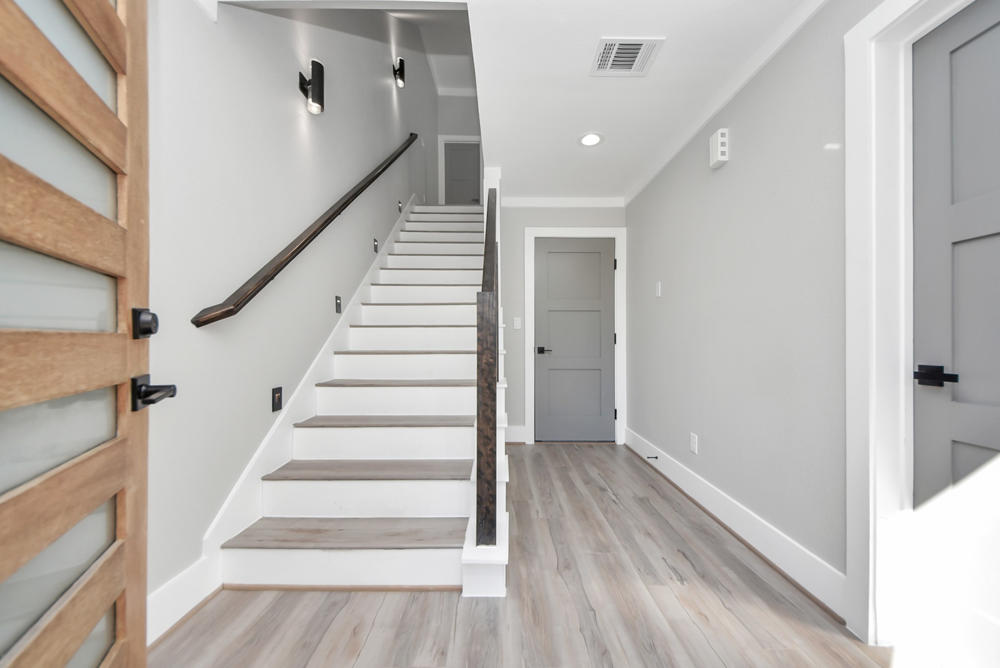 602 West 28th Street, Unit A Houston, TX 77008 - Photo 6 of 41 a view of entryway and hall with wooden floor