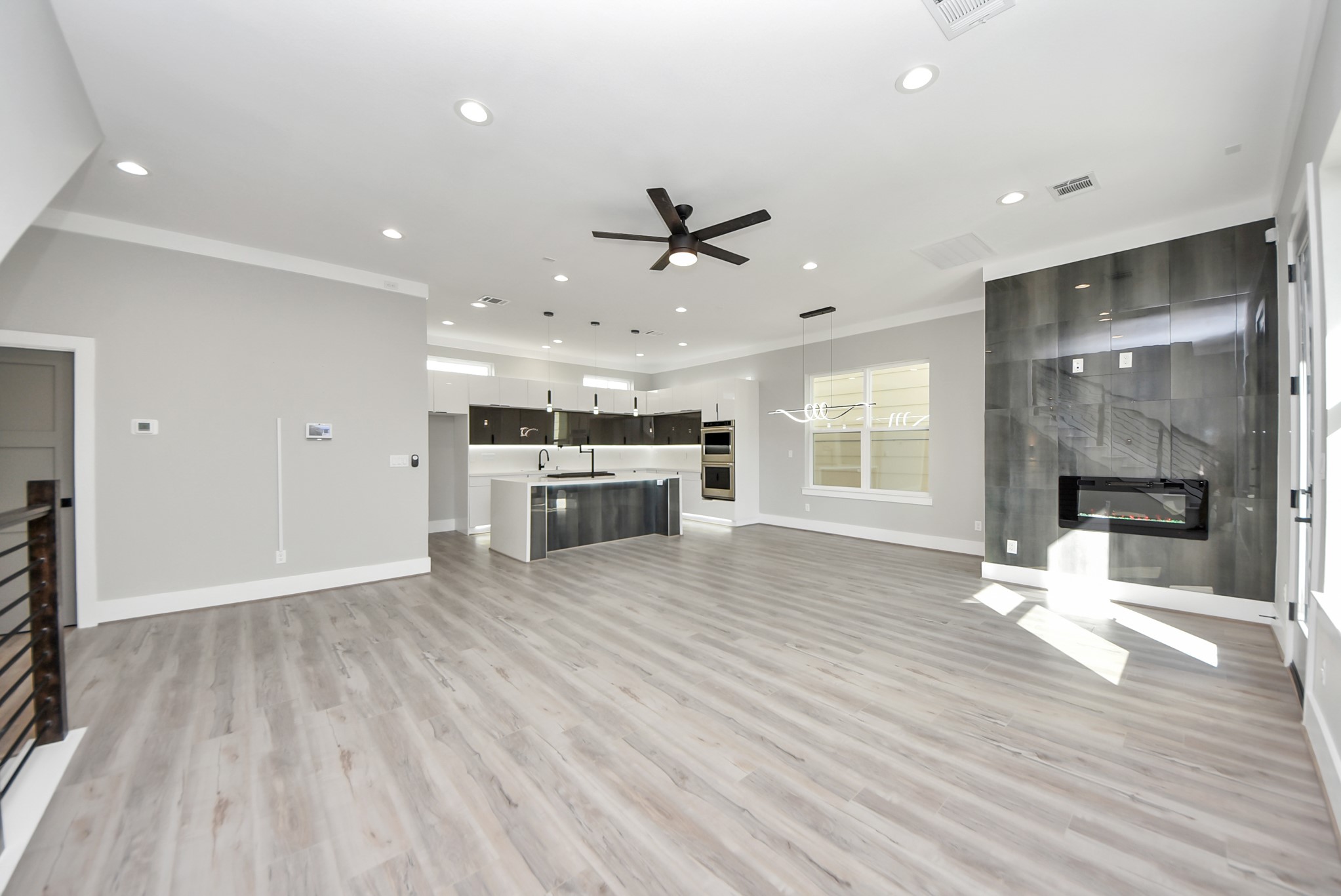 602 West 28th Street, Unit A Houston, TX 77008 - Photo 8 of 41 a view of a kitchen with a sink a refrigerator and a stove top oven
