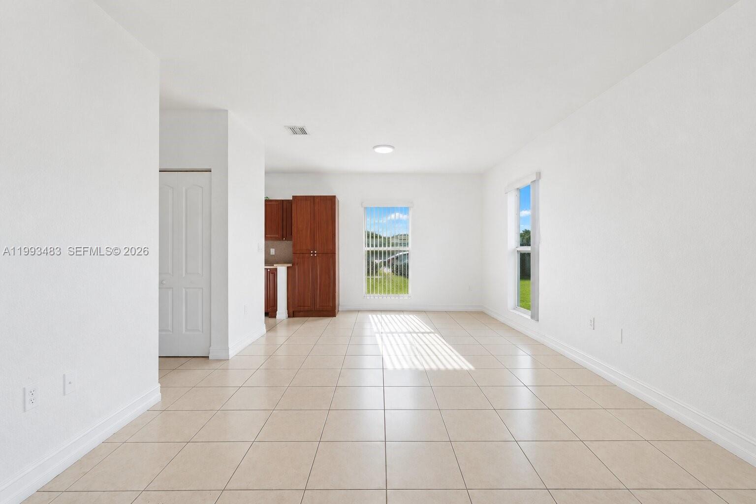 10357 Southwest 178th Street, Unit 10357 Miami, FL 33157 - Photo 8 of 25 a view of an empty room with a window