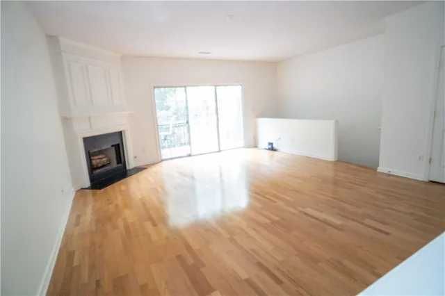 a large white bed in a white room