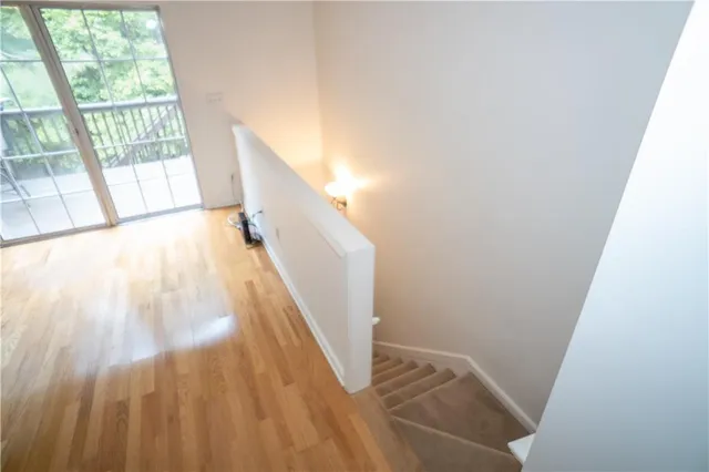 a view of an entryway with wooden floor