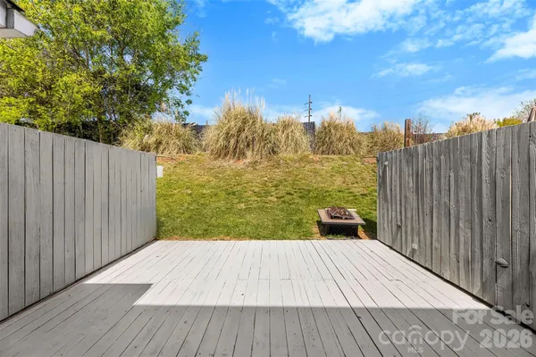 a view of a wooden floor with a wooden fence
