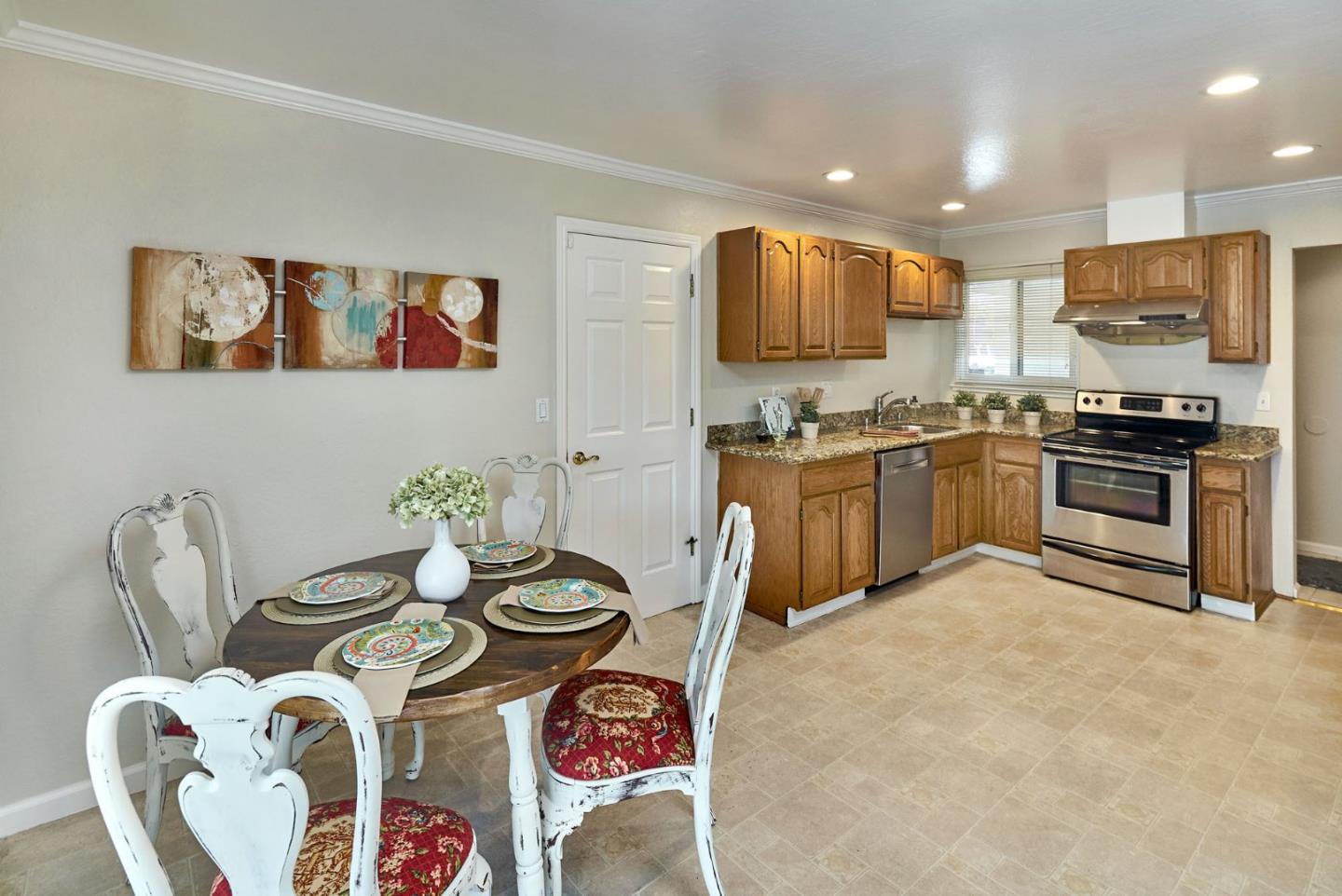 2330 Maximilian Drive Campbell, CA 95008 - Photo 11 of 33 a kitchen with stainless steel appliances granite countertop a stove top oven a sink a dining table and chairs with wooden floor