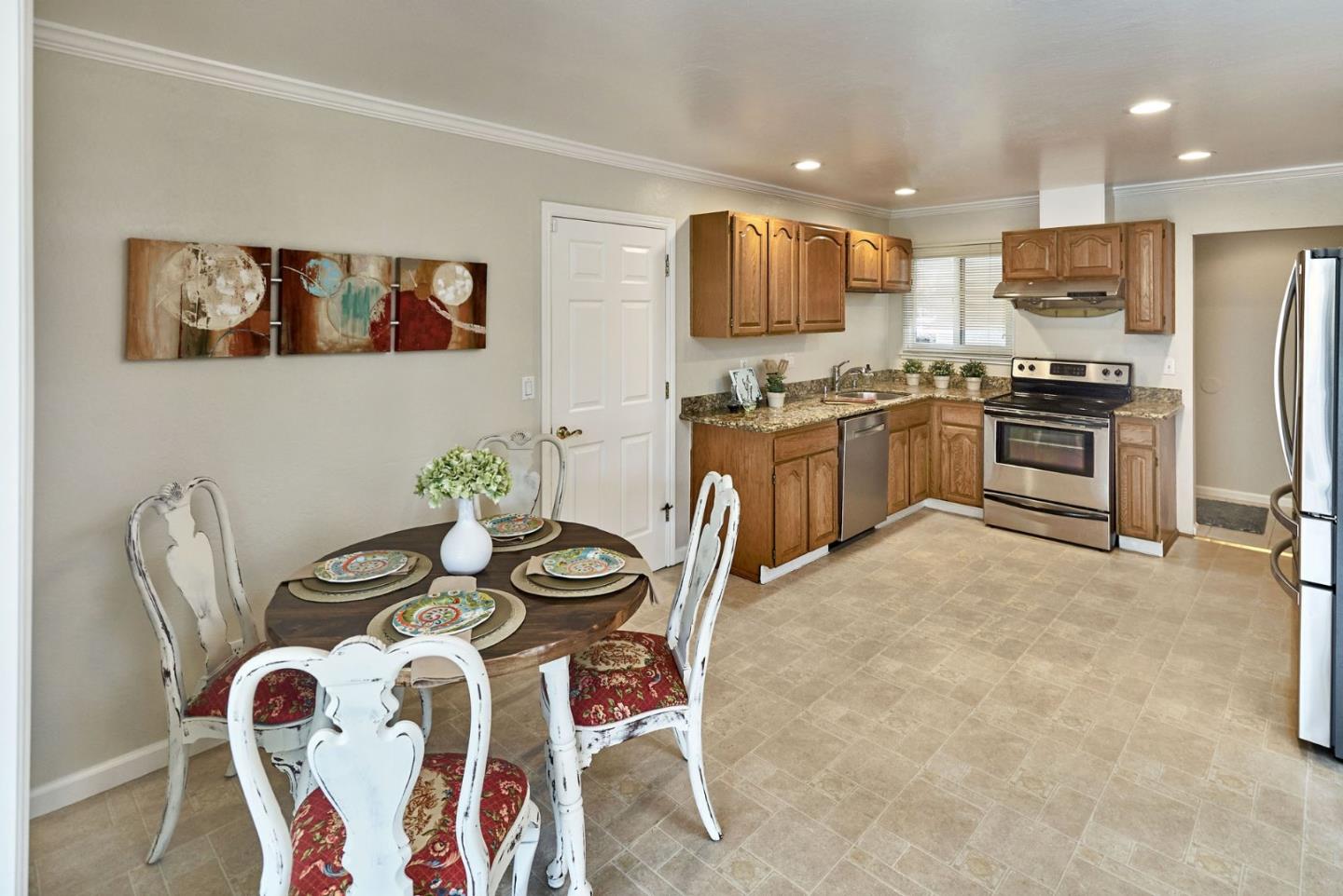 2330 Maximilian Drive Campbell, CA 95008 - Photo 18 of 33 a kitchen with stainless steel appliances granite countertop a stove top oven a sink a dining table and chairs