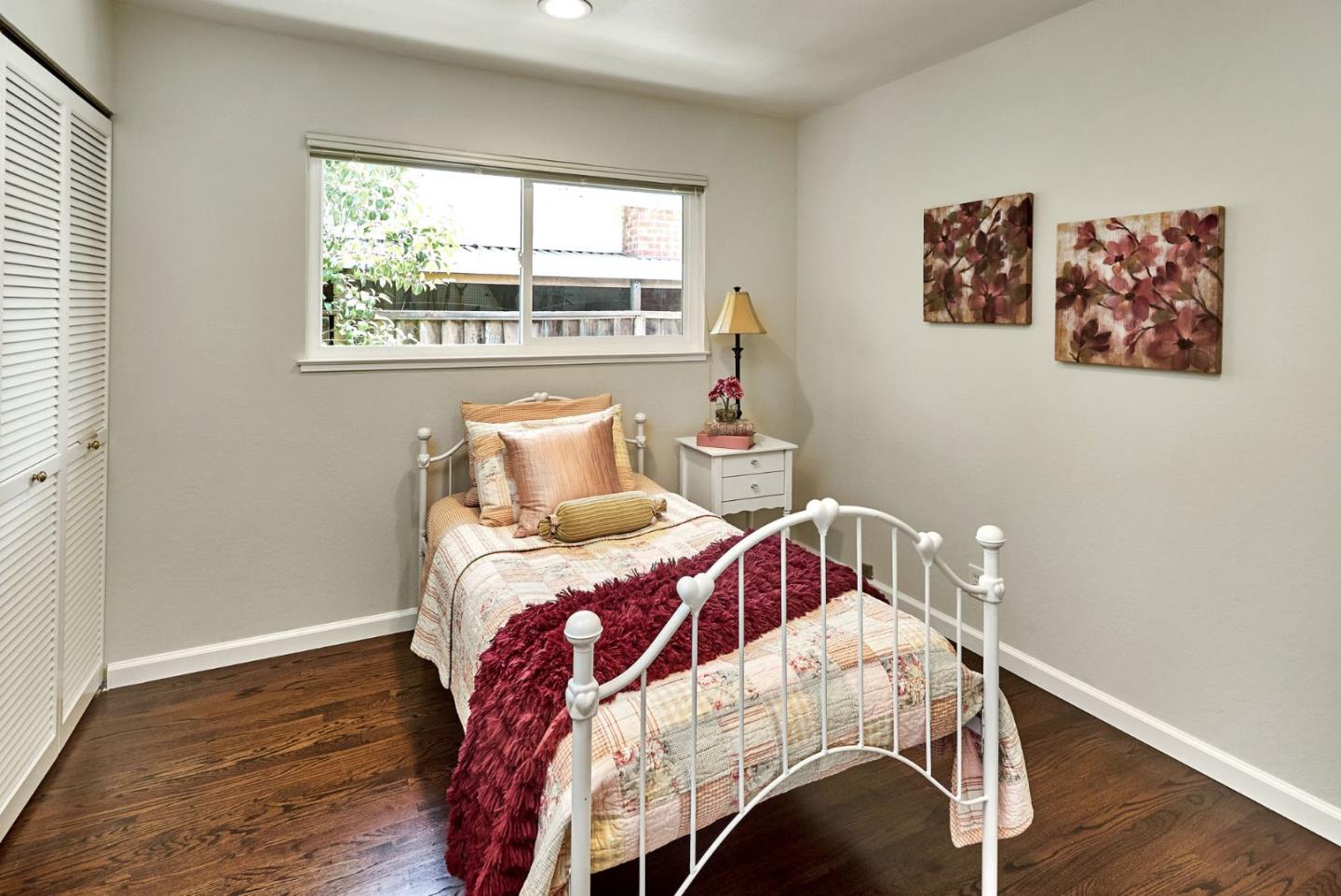 2330 Maximilian Drive Campbell, CA 95008 - Photo 21 of 33 a bedroom with a bed and wooden floor