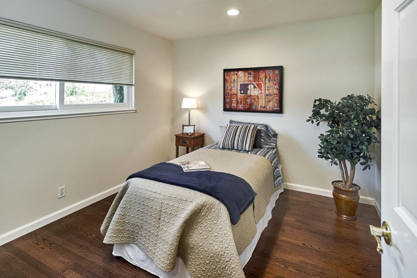 2330 Maximilian Drive Campbell, CA 95008 - Photo 22 of 33 a bedroom with a bed and a potted plant