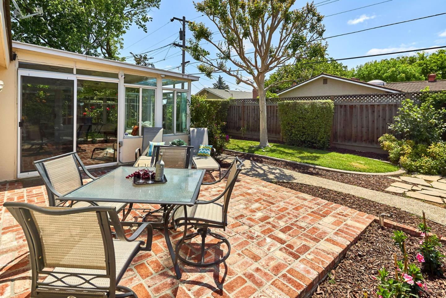2330 Maximilian Drive Campbell, CA 95008 - Photo 30 of 33 a view of a patio with table and chairs and potted plants
