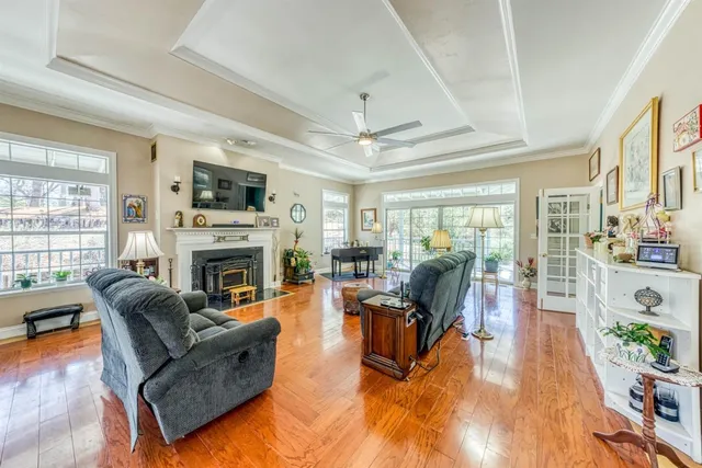 a living room with furniture fireplace and flat screen tv