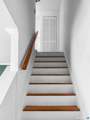 a bathroom with a granite countertop toilet a sink and a bathtub