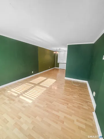 a view of a big room with wooden floor