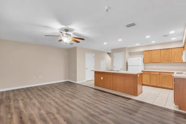 a view of kitchen with wooden floor and window