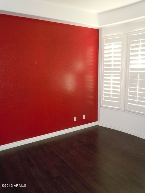 435 South Neuman Way Chandler, AZ 85225 - Photo 13 of 28 a view of an empty room with wooden floor and a window