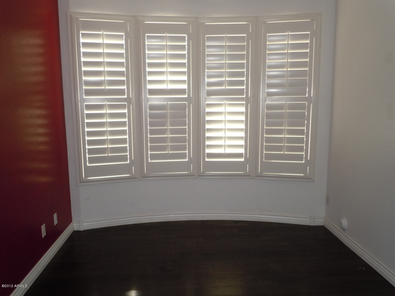 435 South Neuman Way Chandler, AZ 85225 - Photo 18 of 28 a view of an empty room with wooden floor and a window