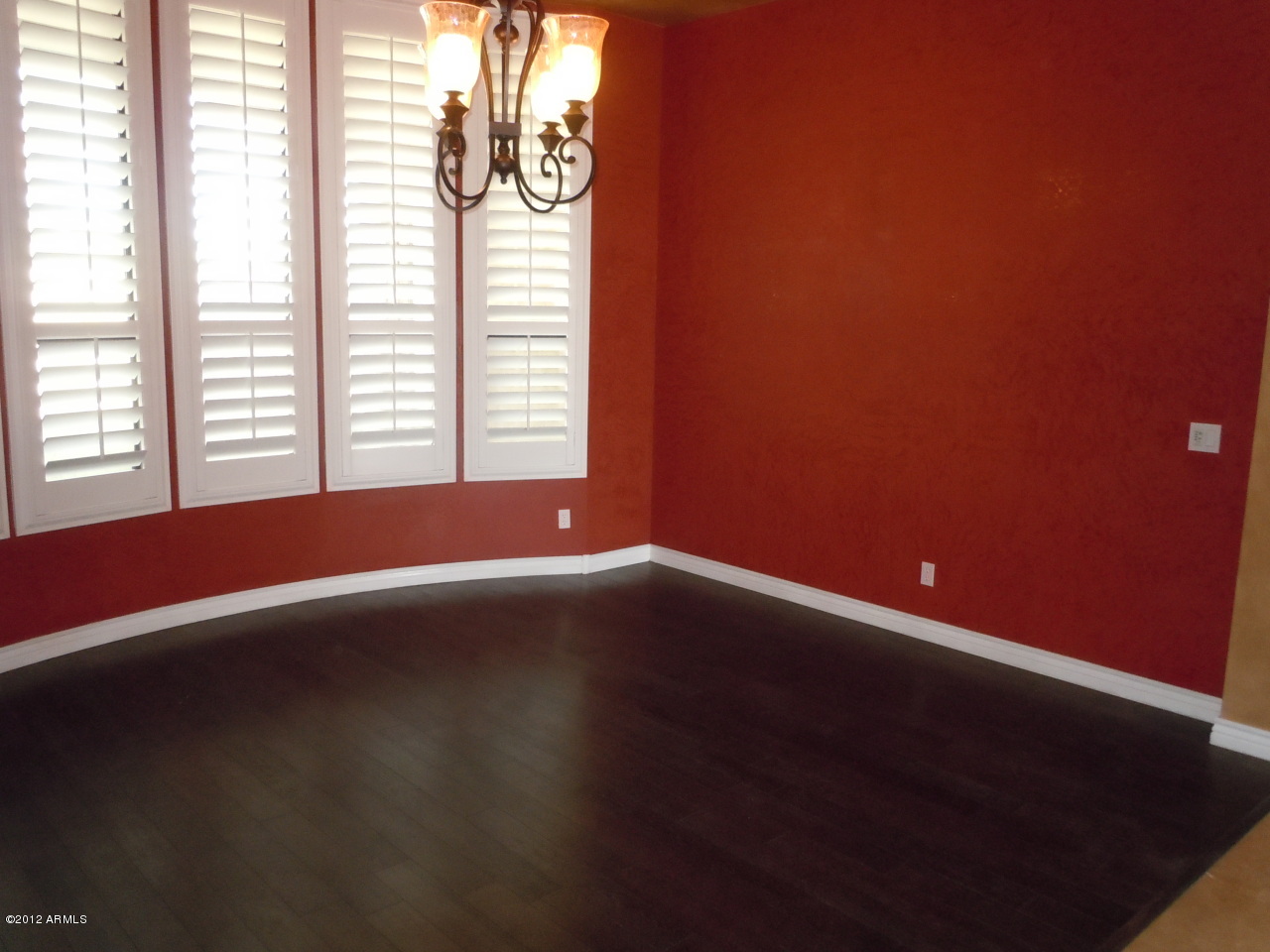 435 South Neuman Way Chandler, AZ 85225 - Photo 21 of 28 a view of an empty room with wooden floor and a window