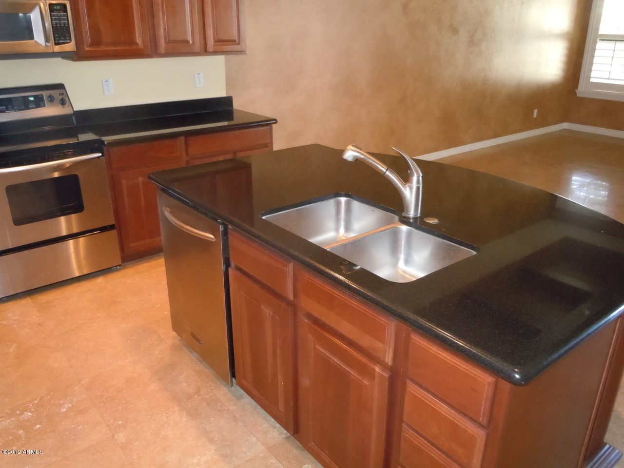 435 South Neuman Way Chandler, AZ 85225 - Photo 9 of 28 a kitchen with granite countertop a sink and a stove