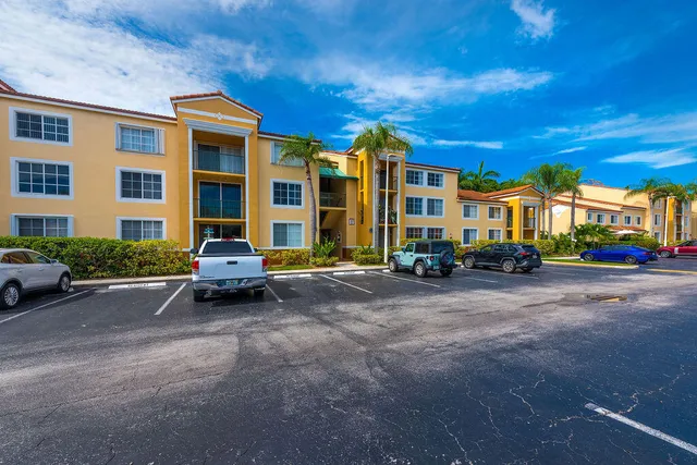 a view of a parked cars in front of a building