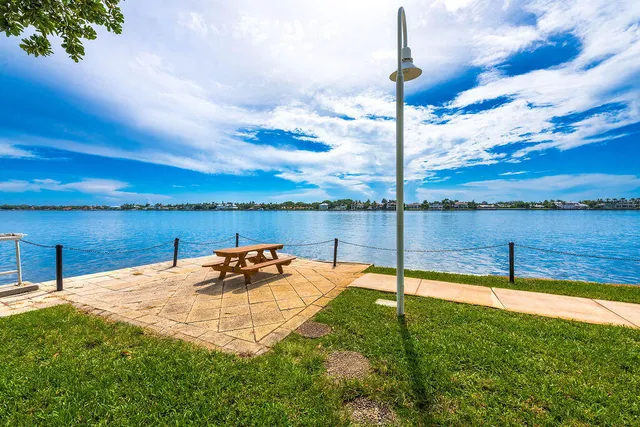 a backyard of a house with outdoor seating