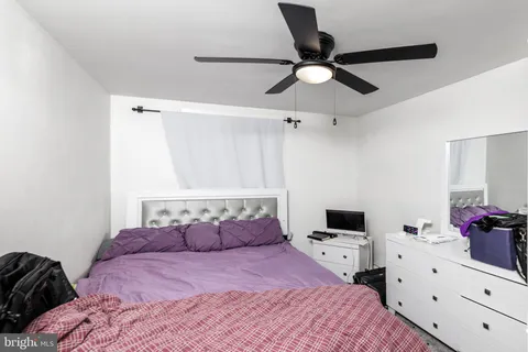 a bedroom with a bed and cabinets