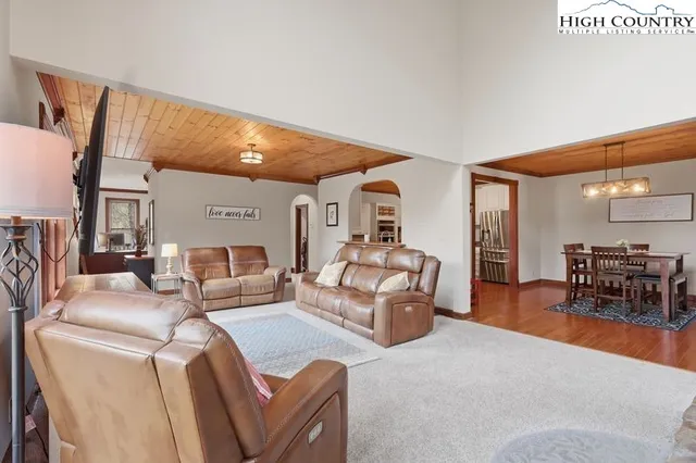 a living room with furniture and a table