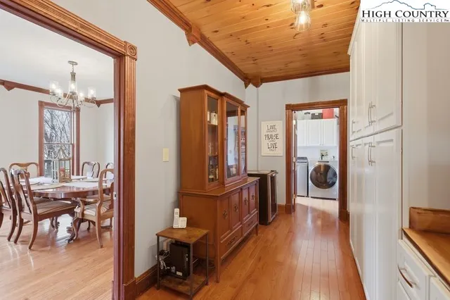 a view of a livingroom with furniture and hardwood floor