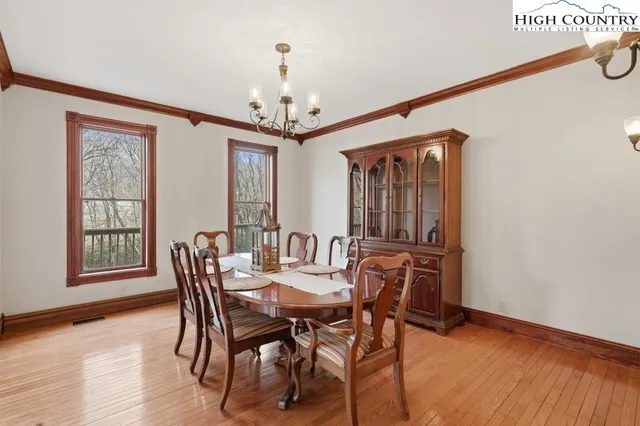 a view of a dining room with furniture and window