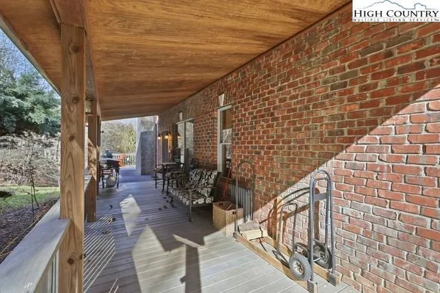 a outdoor space with wooden floor and outdoor seating