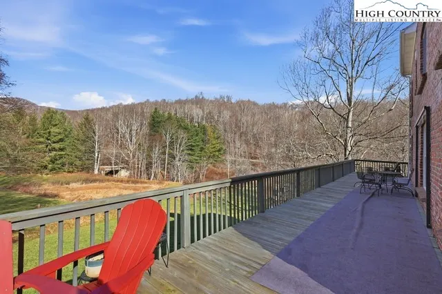 a view of a two chairs on the roof deck