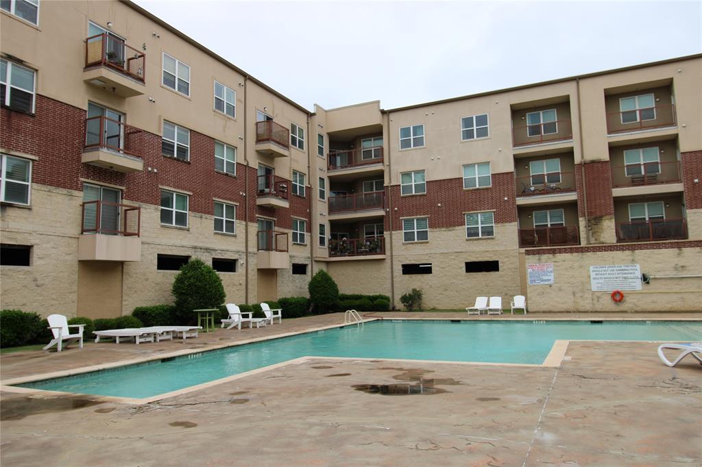 1100 West Trinity Mills Road, Unit 3035 Carrollton, TX 75006 - Photo 3 of 12 a front view of building with yard