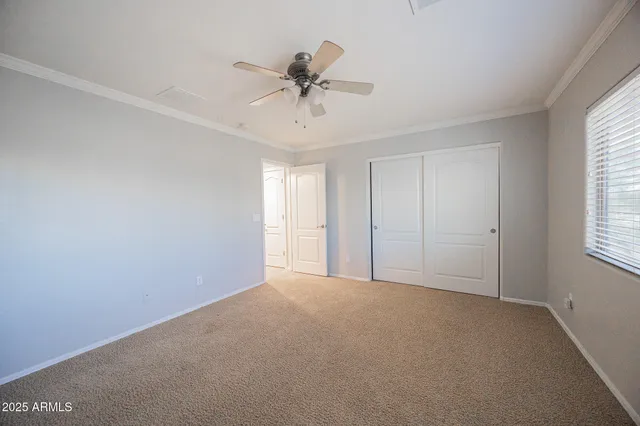 a spacious bathroom with a granite countertop sink a toilet and a bathtub