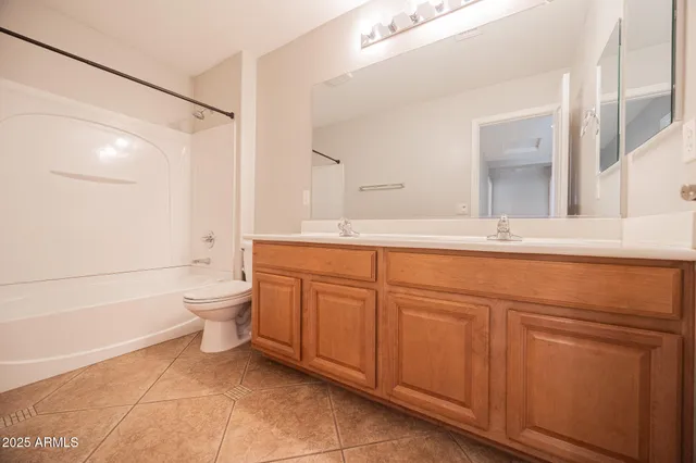 a view of room with a ceiling fan and window