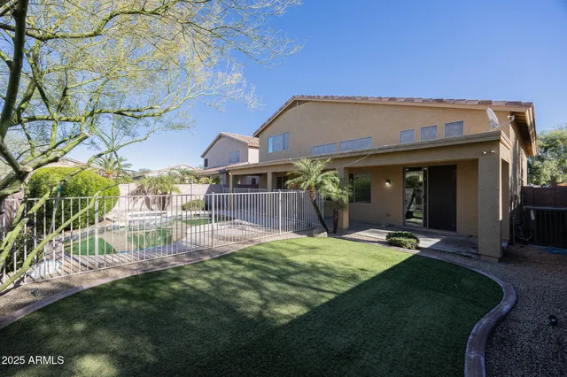 a view of a backyard with sitting area