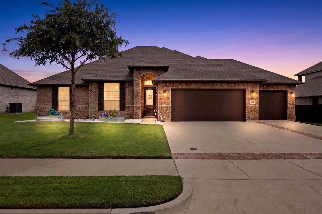 2618 Byrd Ranch Road Midlothian, TX 76065 - Photo 1 of 38 a front view of a house with a garden and yard